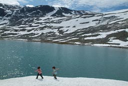 Boys on snow on a lake, Strynefjellet.